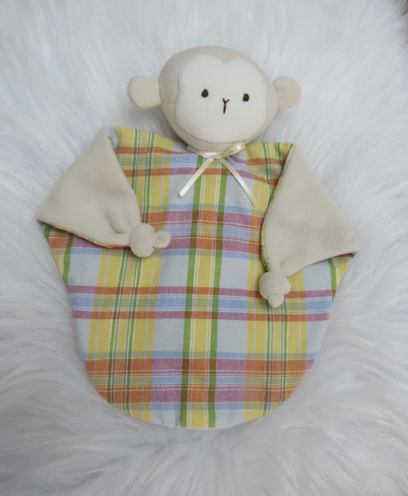 Naninha de macaquinho com corpo xadrez colorido.